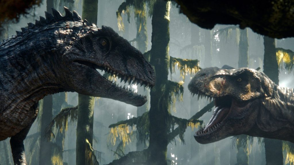 Dwie największe bestie tego Jurassic World, czyli z lewej gigantozaur a z prawej tyranozaur. Obaj przygotowują się do starcia w letniej scenerii 